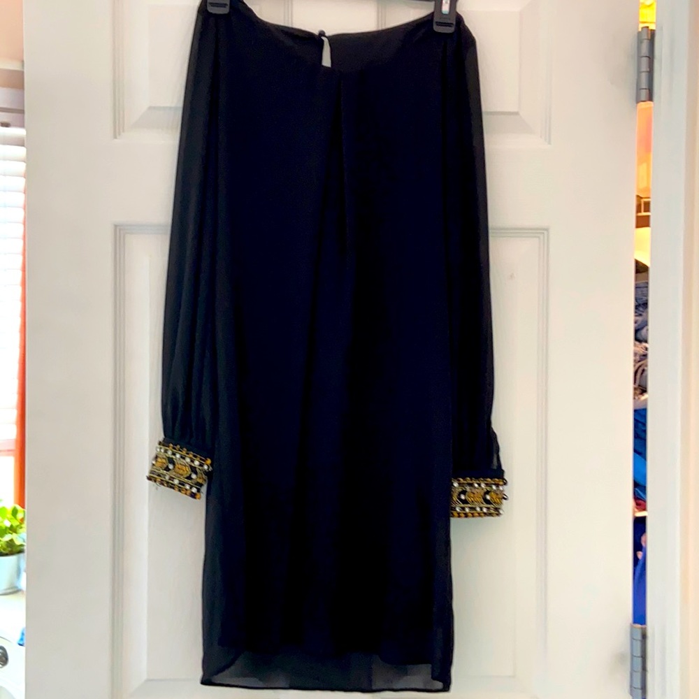 Knee length, black and beaded dress